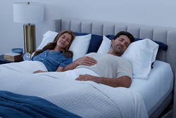 Man and woman asleep on ActiveBreeze bed